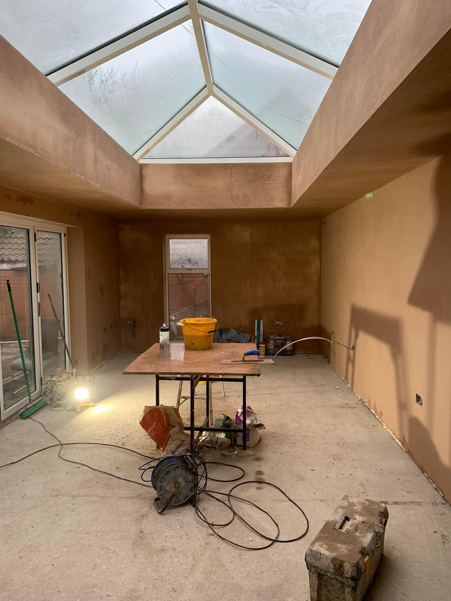 Plastered orangery with a glass lantern roof in Greater Manchester