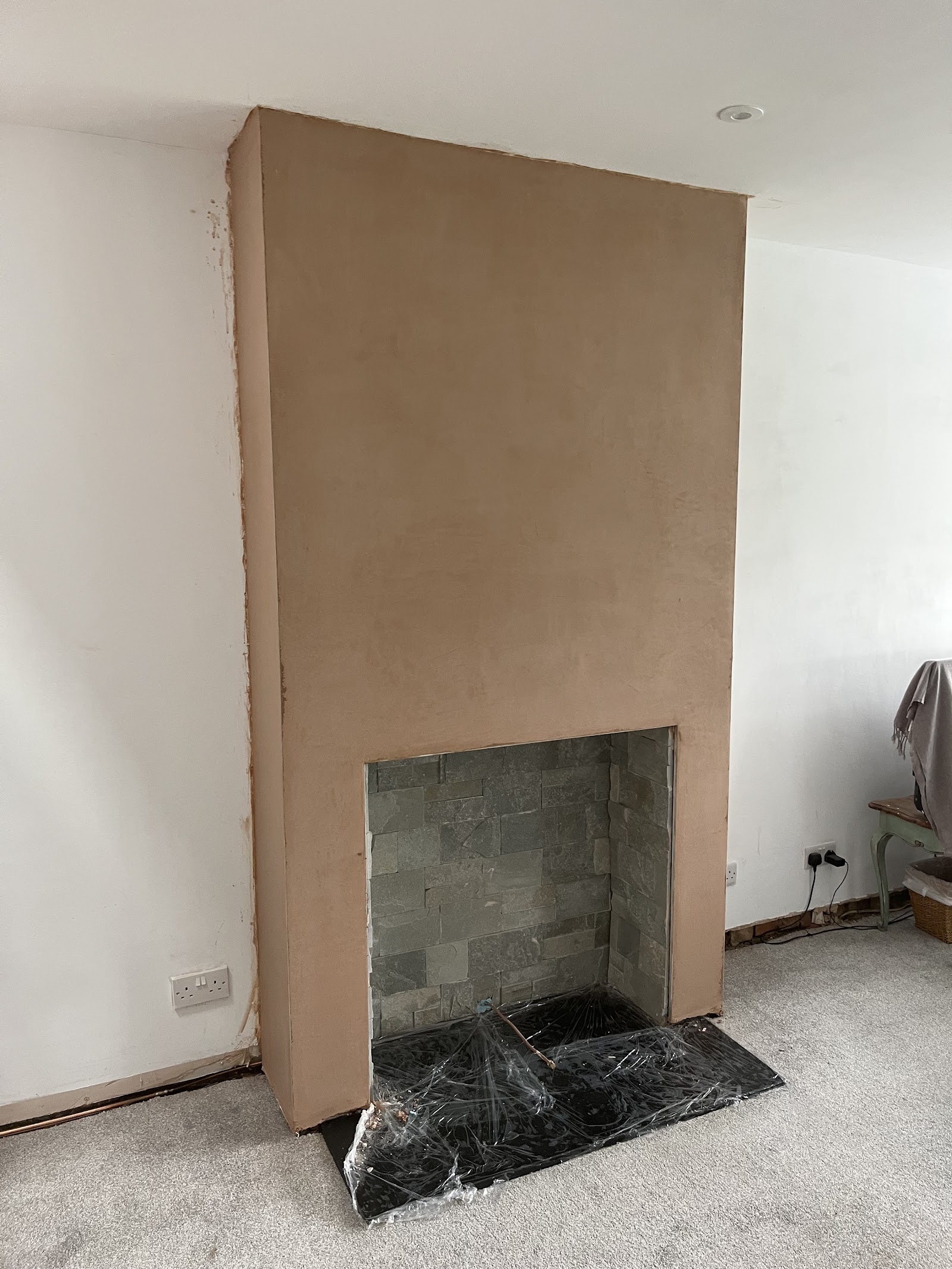 Freshly plastered chimney breast by S J F Plastering in Littleborough